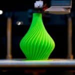 a green color beautiful vase being 3d printed