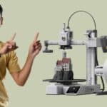 2025 Amazon 3D printer printing colorful home decor. - A sleek 3D printer crafting a vibrant vase on a modern desk