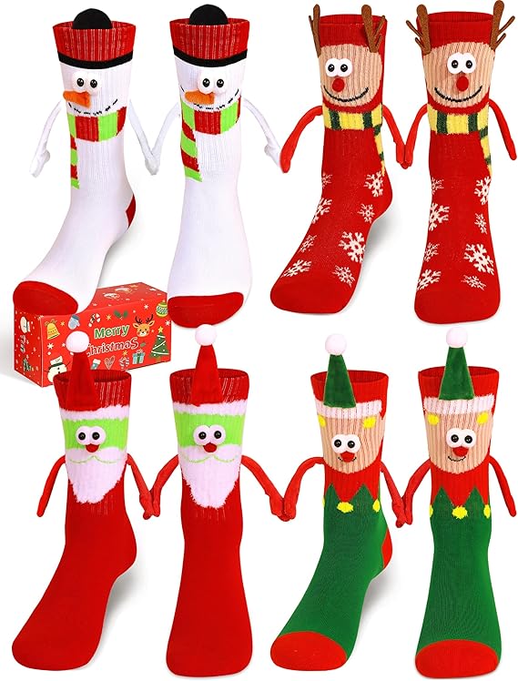 Four pairs of festive Christmas socks with magnetic hand-holding design displayed