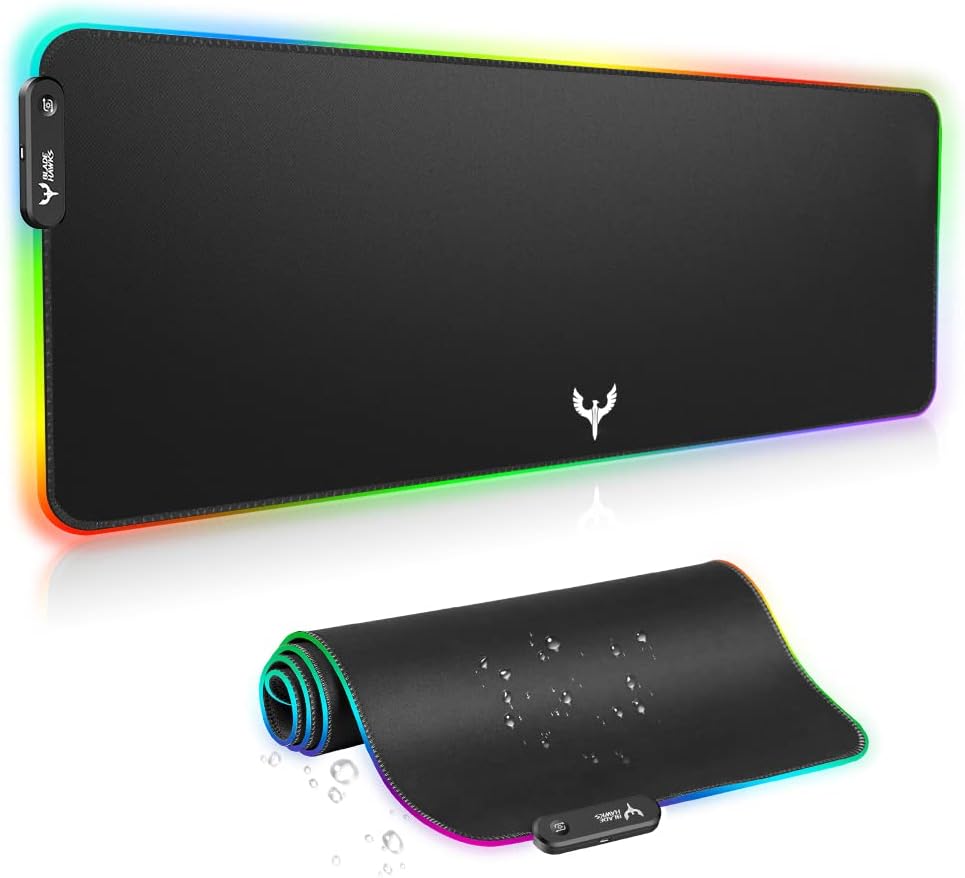BladeHawks extra large RGB gaming mouse pad with colorful LED lighting around edges on black textured surface